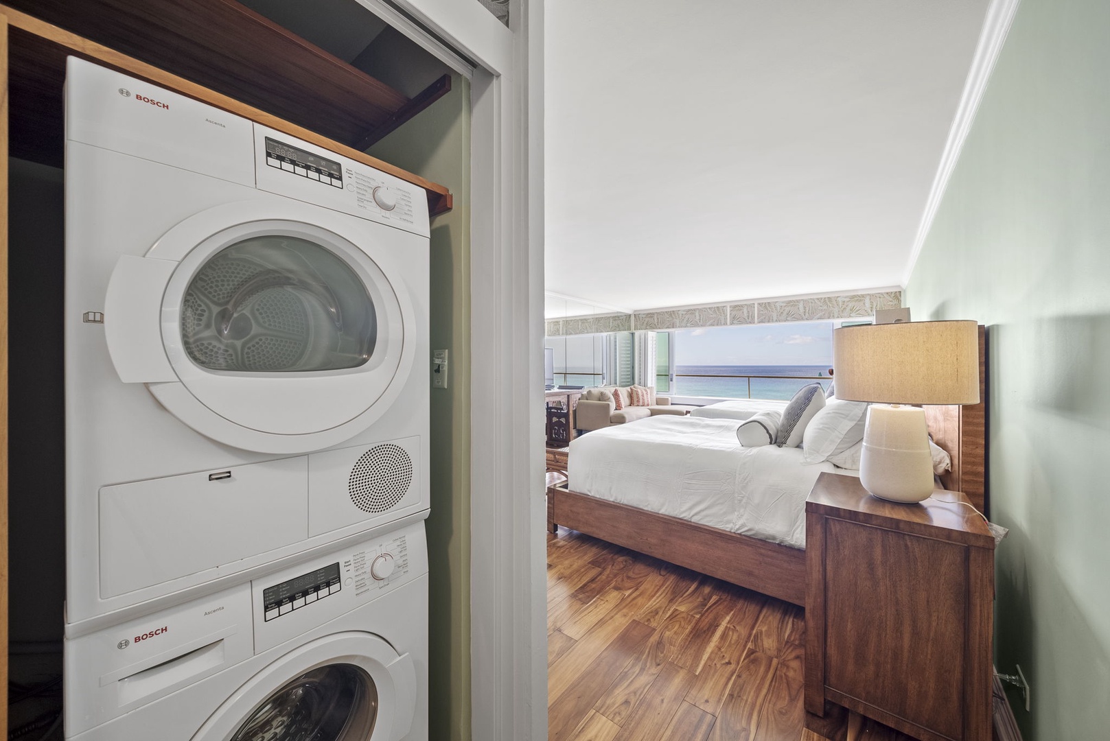 Honolulu Vacation Rentals, Hale Kaimana Breeze - Laundry area with a stacked washer and dryer for your convenience.