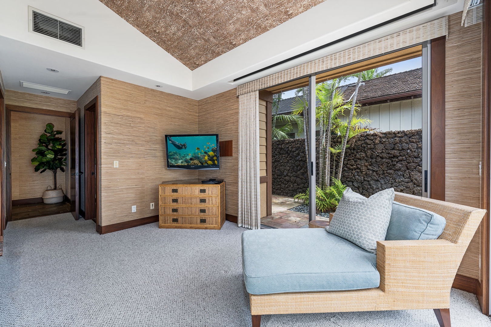 Kailua Kona Vacation Rentals, 3BD Pakui Street Estate (149) at Hualalai Resort - Slide open the bunk room's doors and the garden's right there, with a chair and TV for downtime.