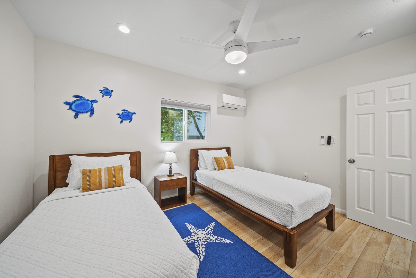 Haleiwa Vacation Rentals, Surfer's Paradise - Second view of the twin bedroom, offering bright windows and a comfortable layout for kids or friends traveling together.