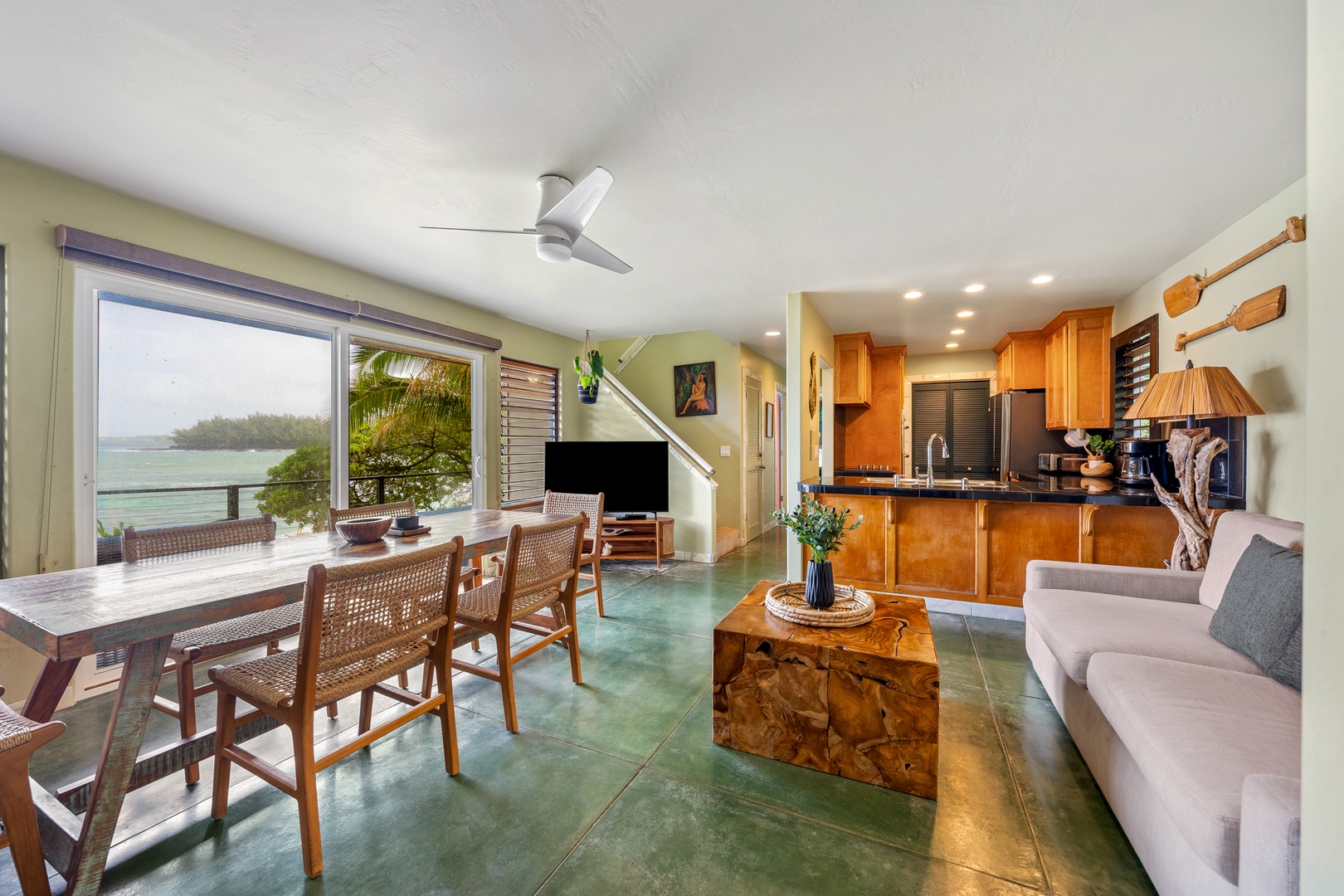 Hanalei Vacation Rentals, Hale Kepuhi - Unwind in your open-plan living space where tropical ocean views frame every meal and moment of relaxation.