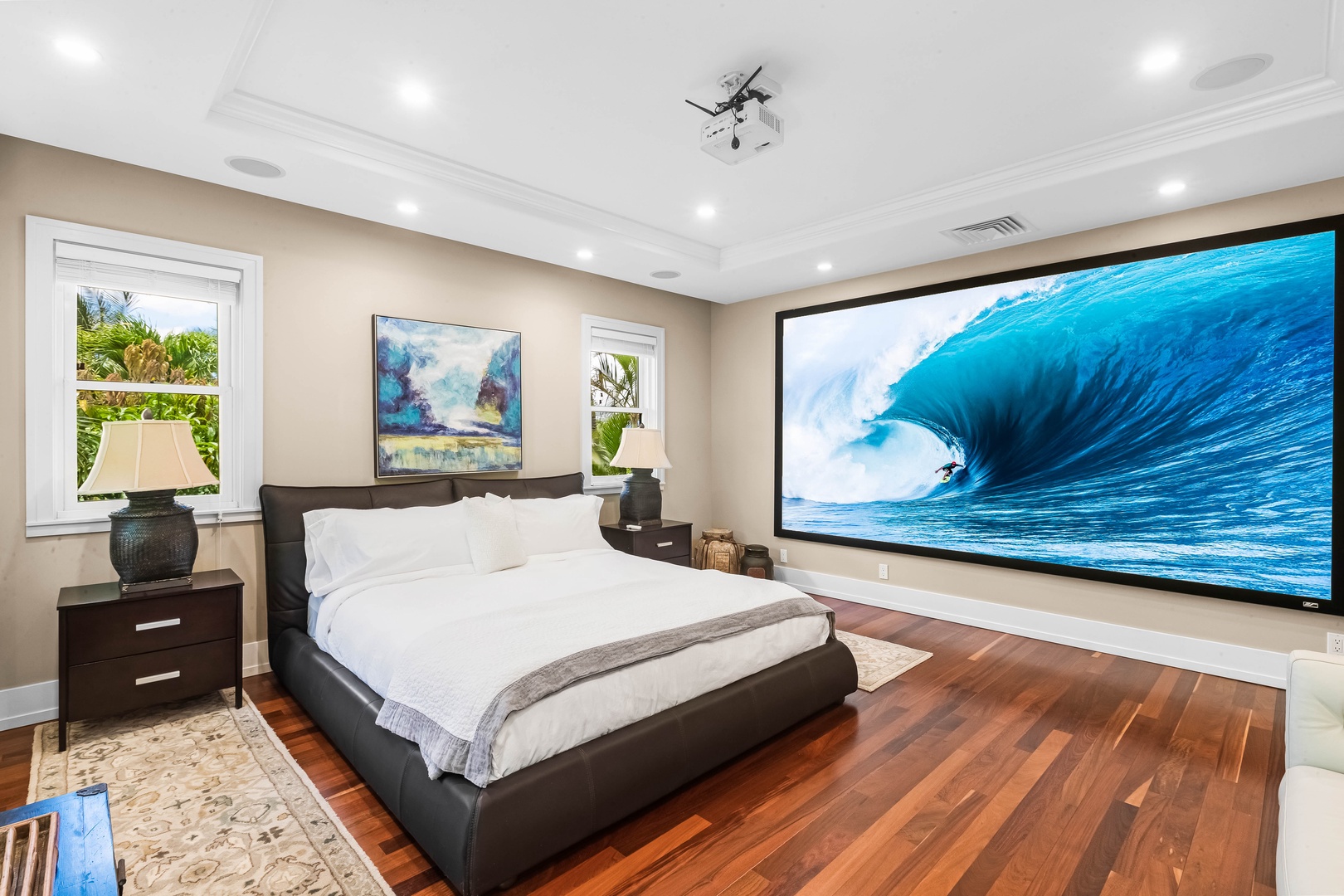 Honolulu Vacation Rentals, Pili Pono - Modern guest suite with platform bed, ocean artwork, and warm floors.