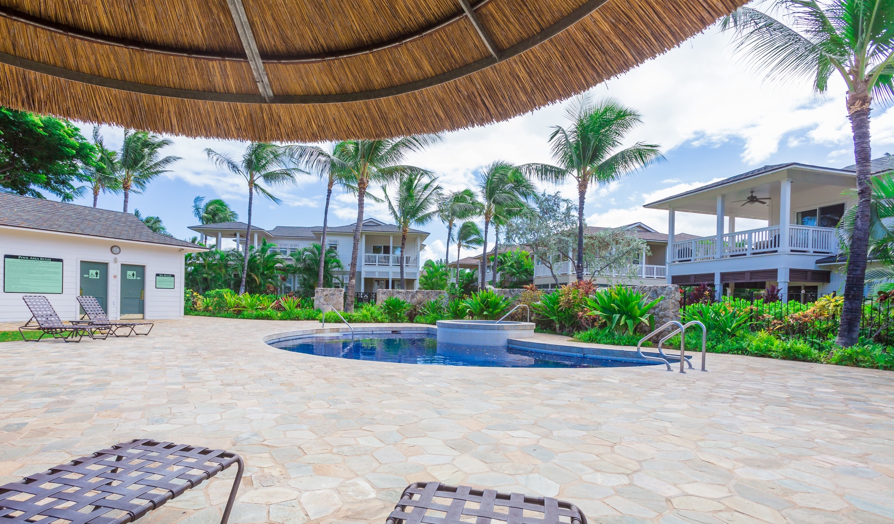 Kapolei Vacation Rentals, Coconut Plantation 1222-3 - Take a book and relax by the crystal blue waters of the community pool.