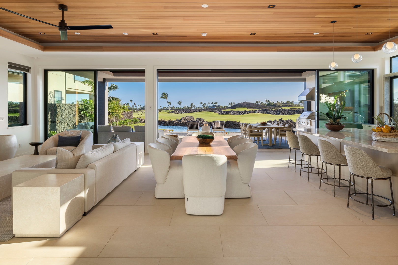 Kamuela Vacation Rentals, 6BD Mauna Lani Lux Golf Estate (6) at One Ocean - Sliding glass walls invite the outdoors in, creating a bright gathering space with pool and fairway views at every turn.