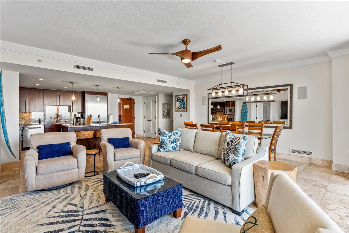 HI Vacation Rentals, Honua Kai Hokulani 825 - Spacious open-concept living area with stylish furnishings and modern amenities.