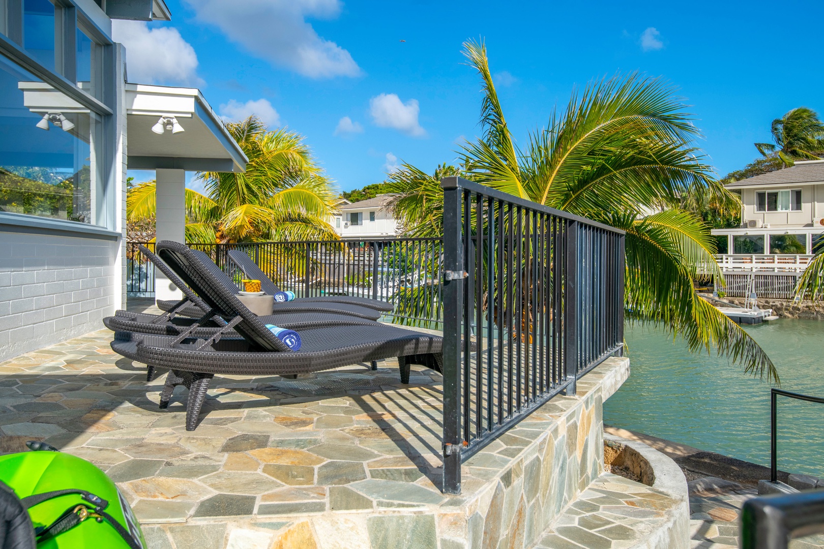 Honolulu Vacation Rentals, Holoholo Hale - Soak up the sun on the back marina-front lanai.