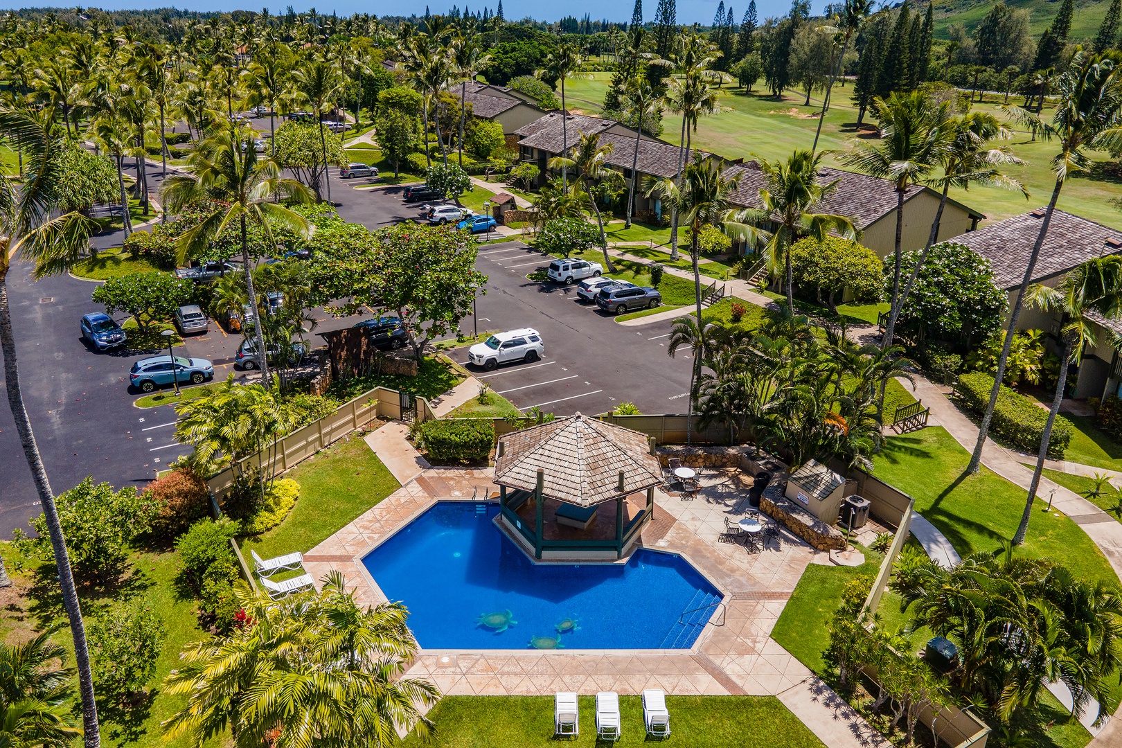 Kahuku Vacation Rentals, Pulelehua Kuilima Estates West #142 - Aerial shot of the community pool area.