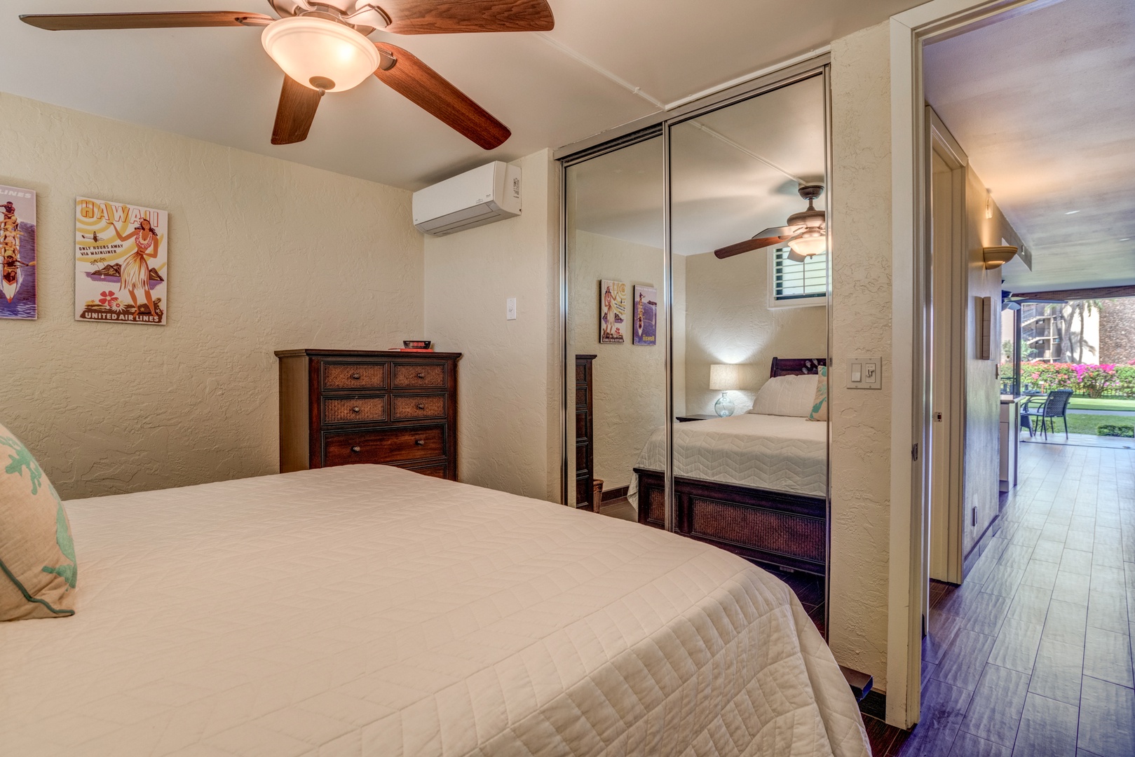 Lahaina Vacation Rentals, Papakea B-105 - This cozy bedroom features a mirrored closet that enhances the natural light, giving the room a more open feel