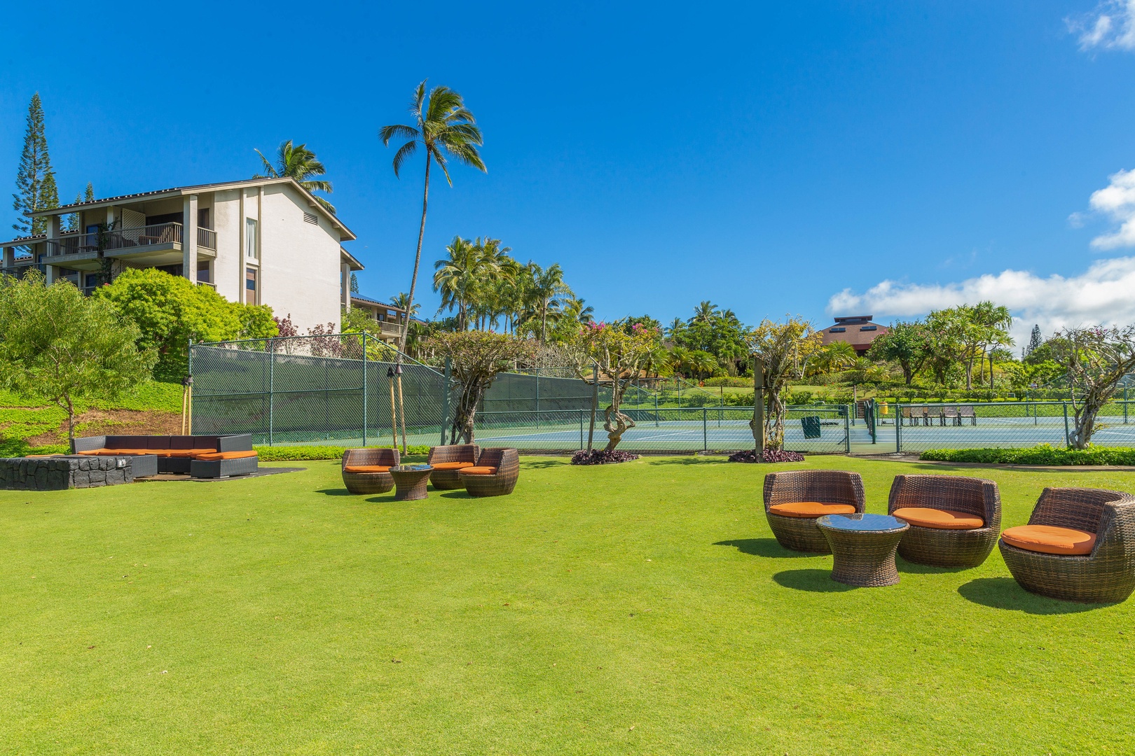 Princeville Vacation Rentals, Hanalei Bay Resort 1535/6 - Unwind on the lawn with a drink, good company, and blue-sky views.