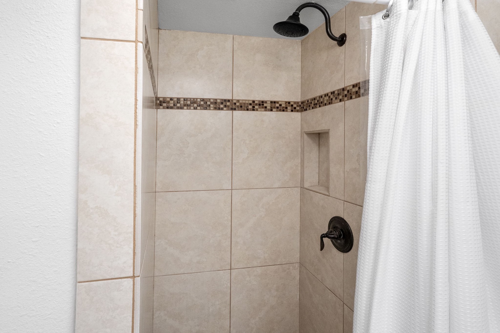 Kailua Kona Vacation Rentals, Sea Village 4213 - Walk-in tiled shower in the primary ensuite—spa-inspired and ideal for relaxing after a day exploring Kona.