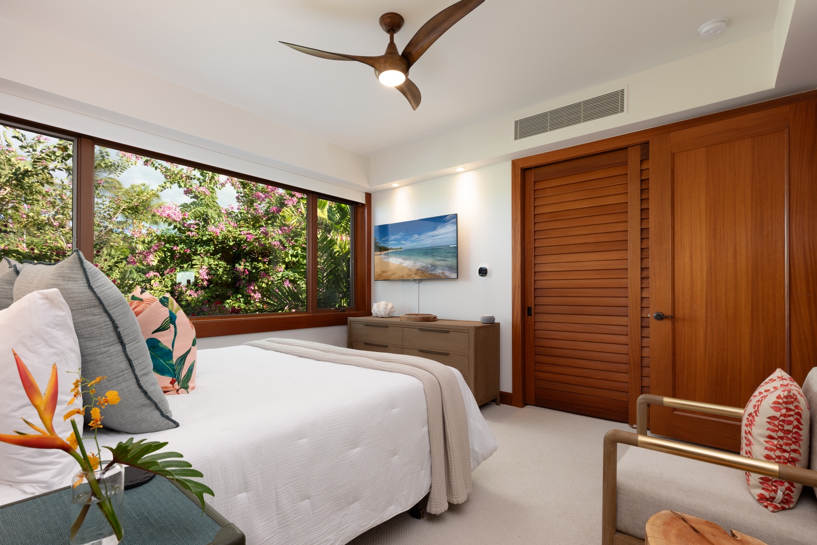 Kailua Kona Vacation Rentals, 3BD Waiulu Villa 111D at Hualalai Resort - Bright guest bedroom with a Cal-King sized bed and large windows offering lush garden views.