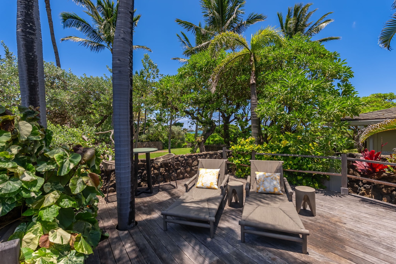Kailua Vacation Rentals, Kailua Beach House - Unwind on your private outdoor lounge surrounded by swaying palms and lush tropical gardens, where ocean breezes and island tranquility create the perfect escape.