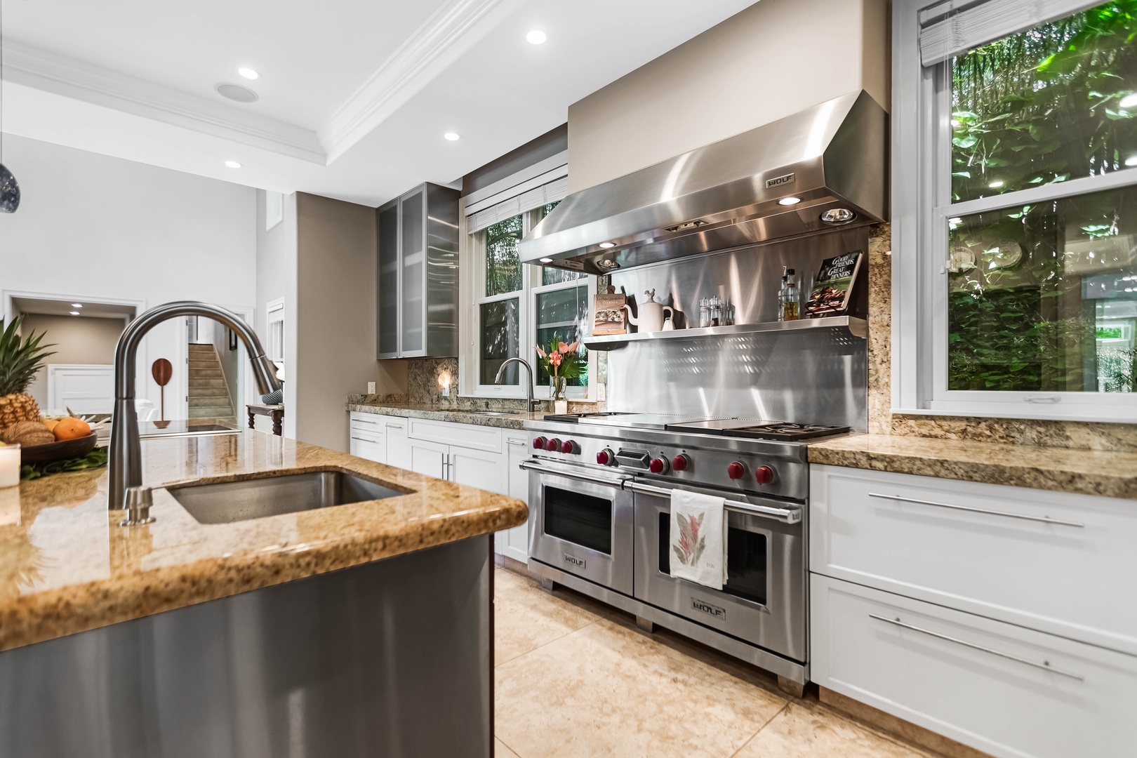 Honolulu Vacation Rentals, Pili Pono - Chef’s kitchen with chef-style stainless steel appliances and custom cabinetry.