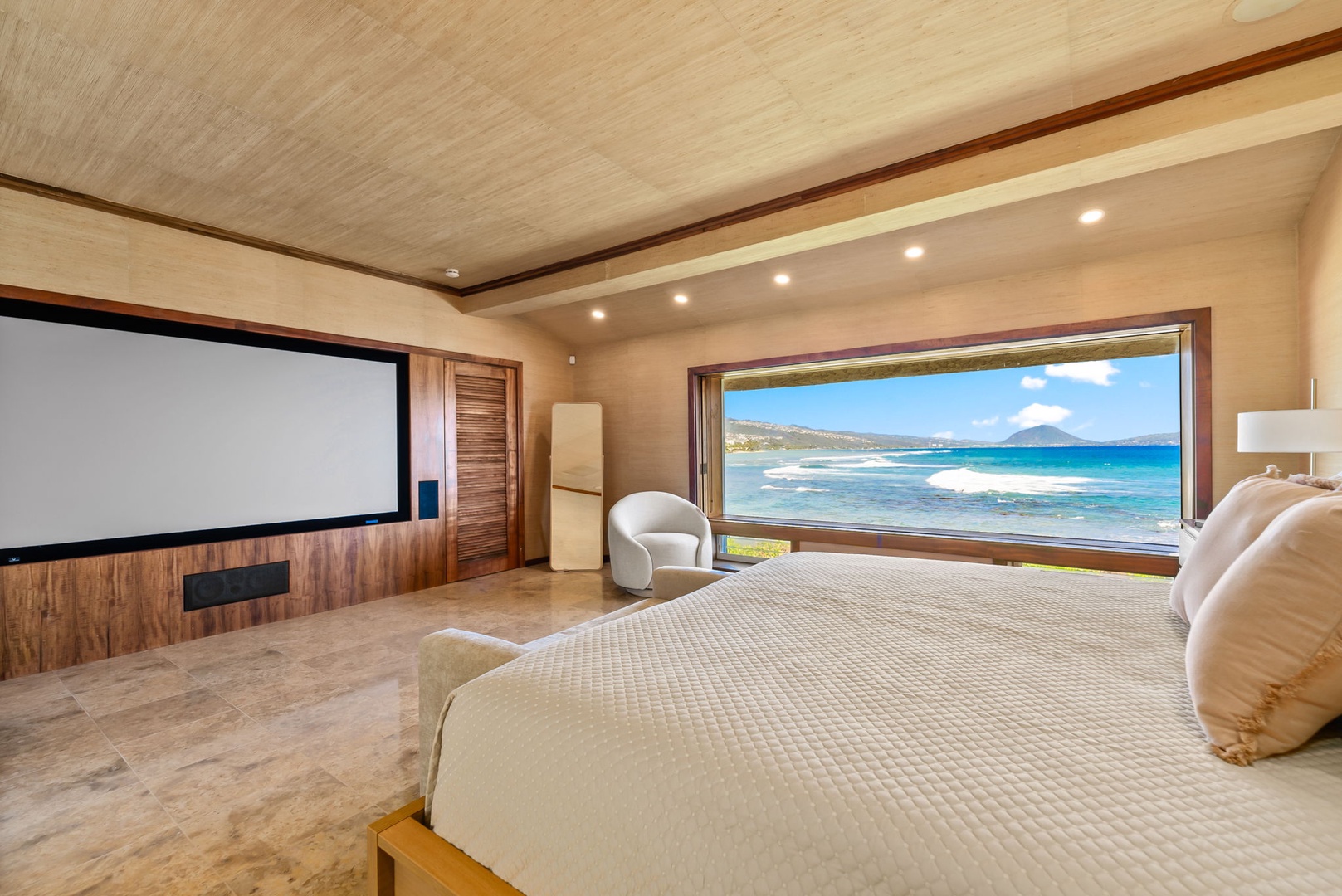 Honolulu Vacation Rentals, Black Point Ocean Villa - Breathtaking ocean views from your bed, then unwind with movies on the large screen in your luxurious suite.