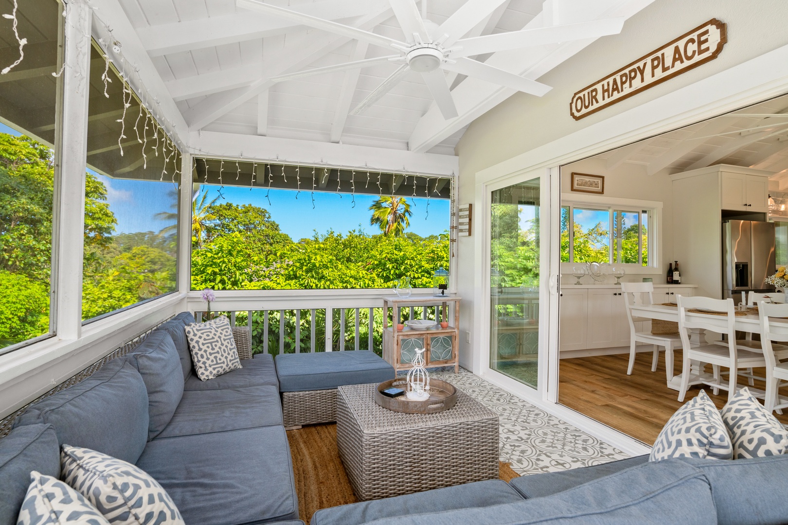 Princeville Vacation Rentals, Ola Hou - Entire Property - Gather around this inviting lanai, ideal for gatherings while enjoying garden views and natural light.