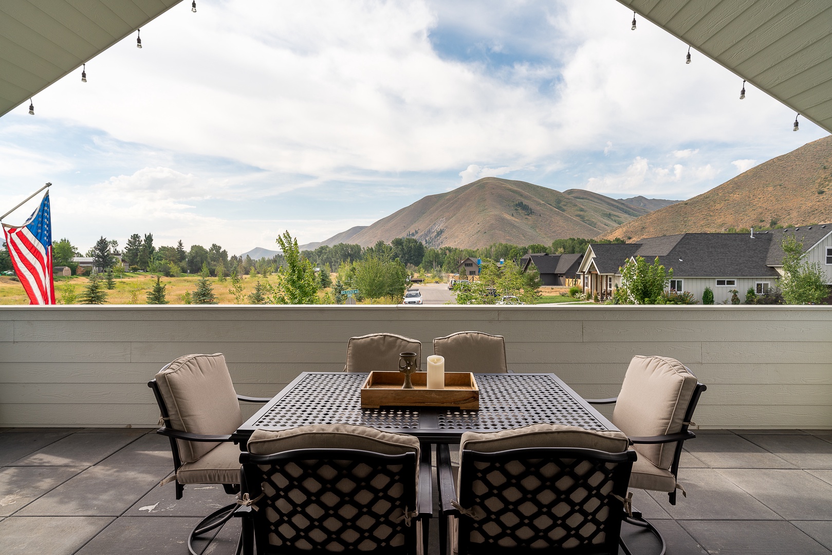 Hailey Vacation Rentals, Contemporary Red Feather Comfort - The outdoor dining table on the upper-level balcony offers amazing mountain views