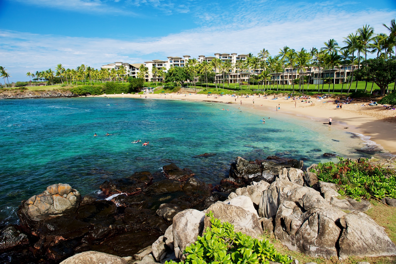 Lahaina Vacation Rentals, Kapalua Ridge 1421 - A stunning view of a rocky shoreline leading into a pristine beach with crystal-clear waters.