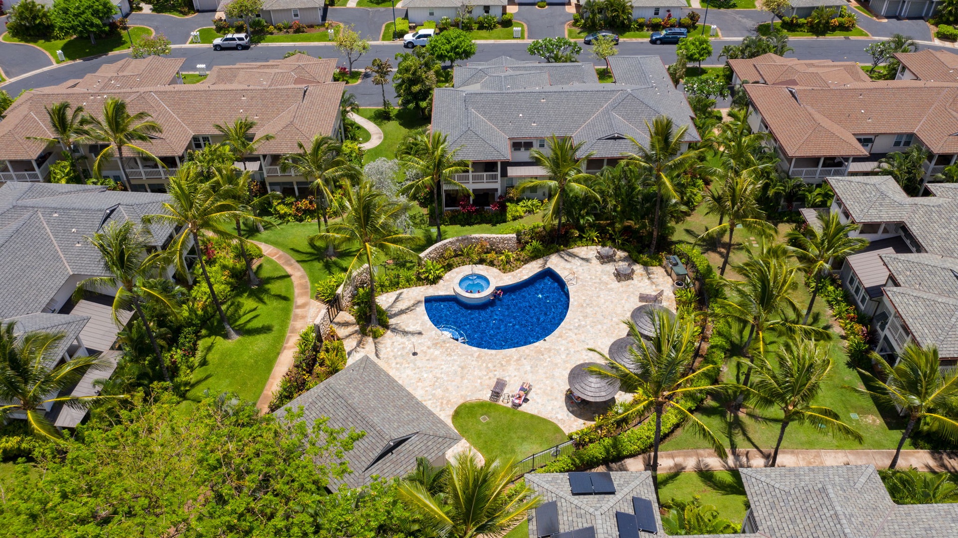 Kapolei Vacation Rentals, Coconut Plantation 1080-4 - A bird's-eye view of the community pool set among the townhome rooftops.