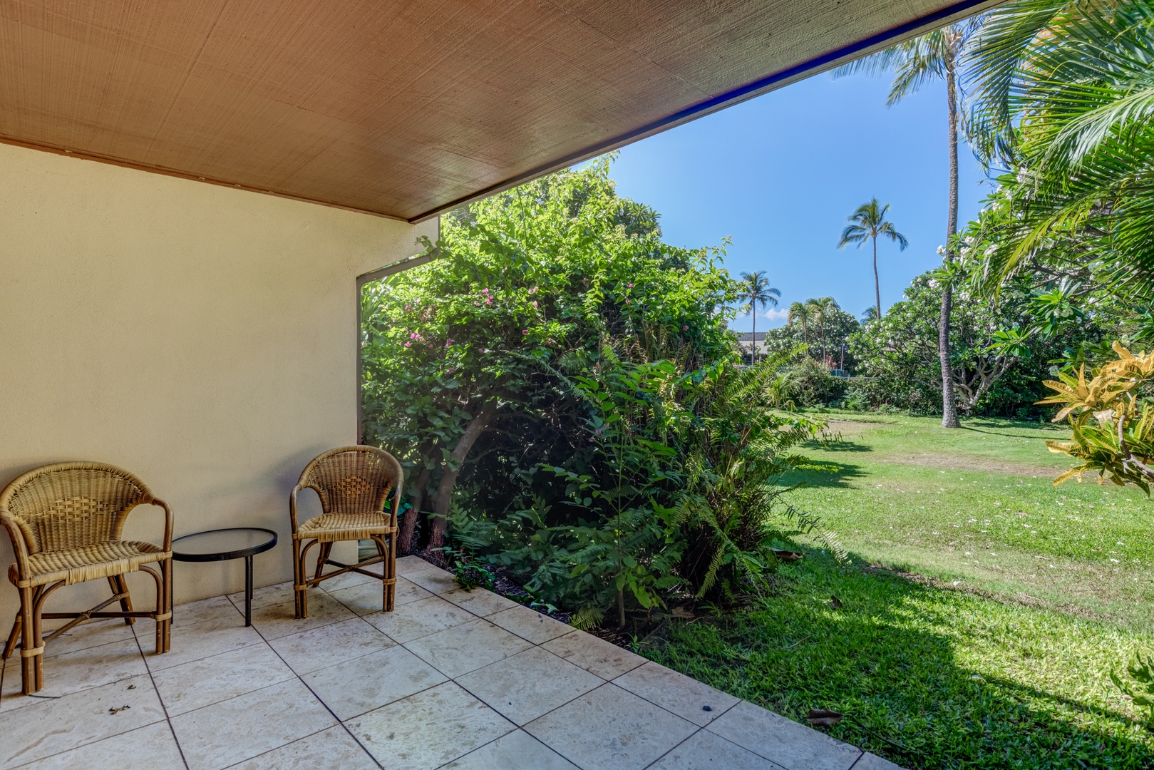 Kihei Vacation Rentals, Koa Resort 1B - Garden-level lanai with seating—perfect for morning coffee, sunset wine, or simply soaking in the Maui breeze.