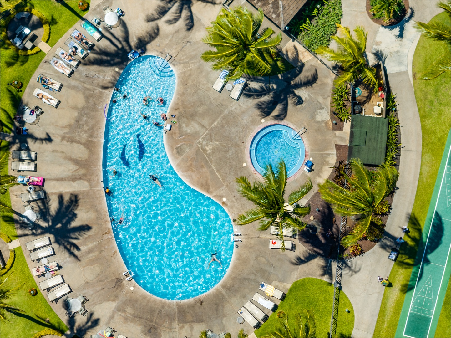 Lahaina Vacation Rentals, Papakea B-105 - Overhead shot of Papakea B-105’s pool, hot tub, and shuffleboard courts.