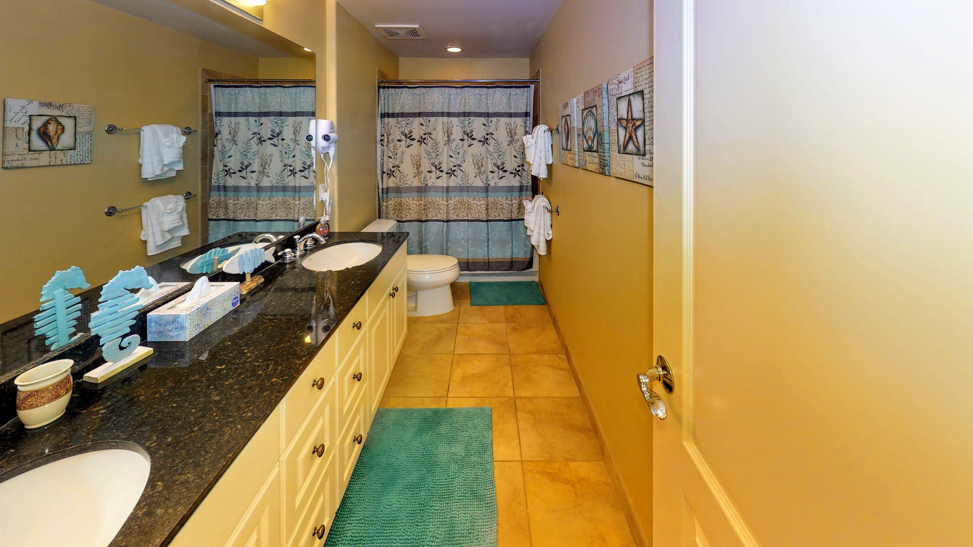 Kapolei Vacation Rentals, Ko Olina Kai 1029B - The primary guest bathroom with a large vanity and shower.
