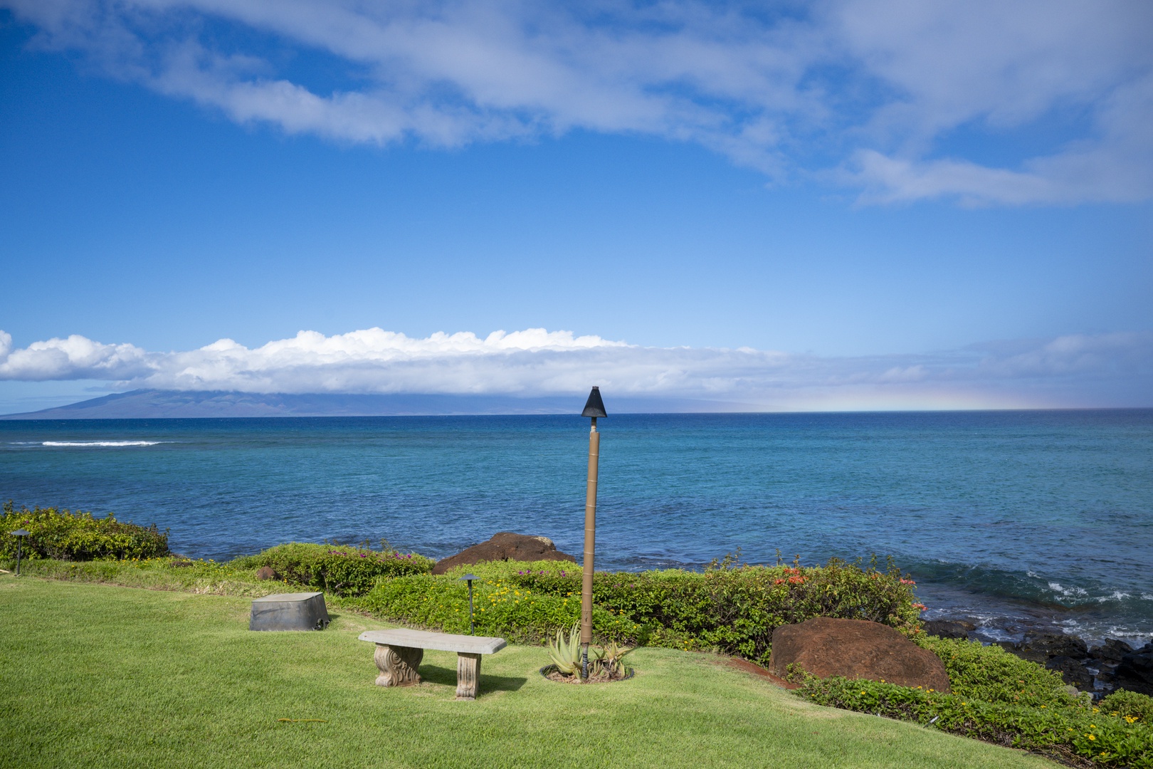 Lahaina Vacation Rentals, Polynesian Shores 114 - Walk down to the water's edge and take the bench where the lawn meets the rocks.