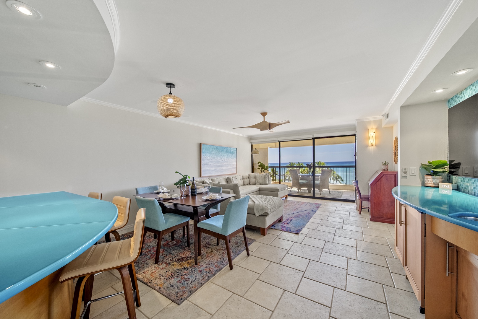 Honolulu Vacation Rentals, Aston Waikiki Beach Tower 602 - Relax in a cozy dining area while enjoying ocean views through floor-to-ceiling windows.