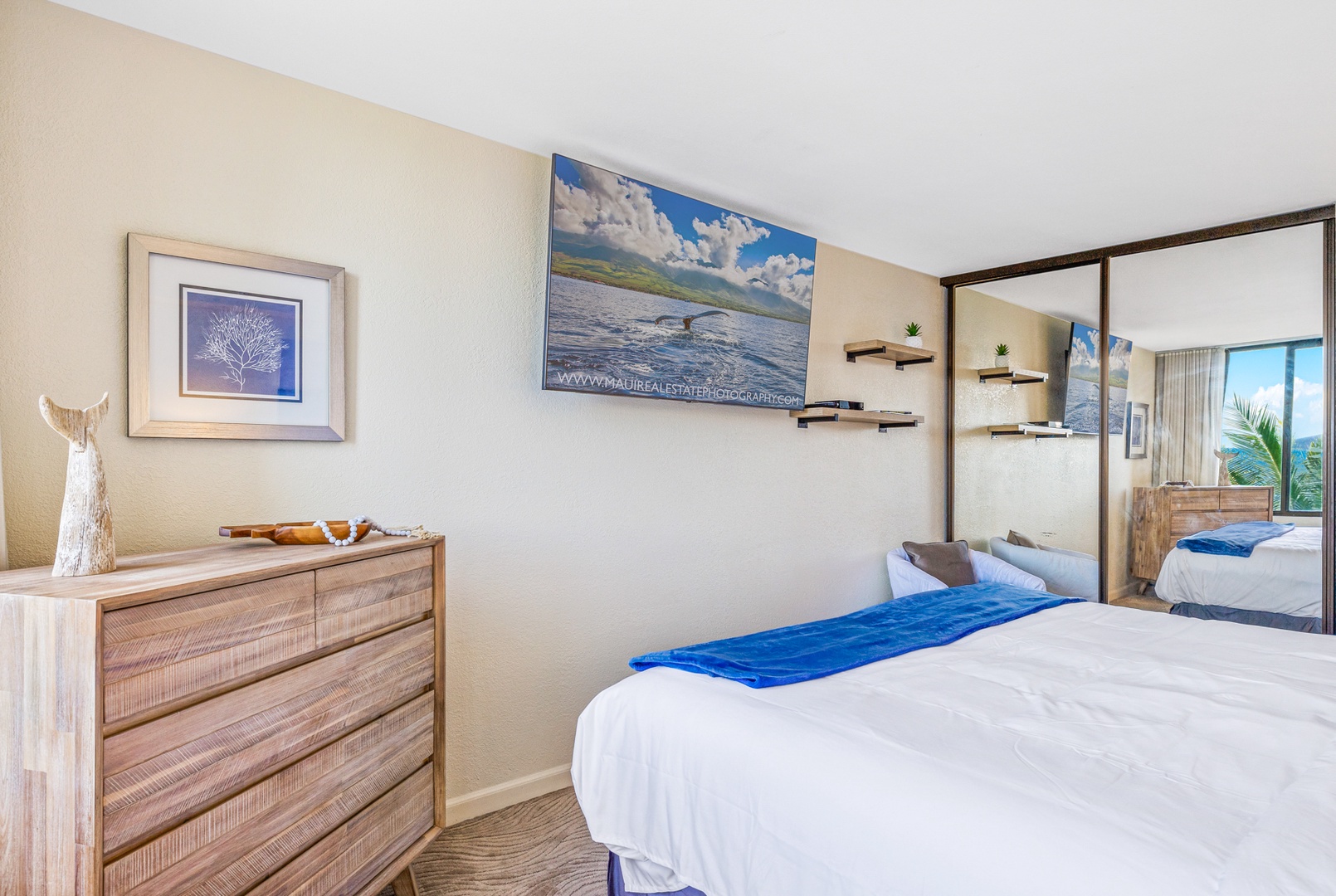 Lahaina Vacation Rentals, Kaanapali Shores 502 - The cozy bedroom provides a relaxing retreat with a soft bed, modern decor, and a scenic view.