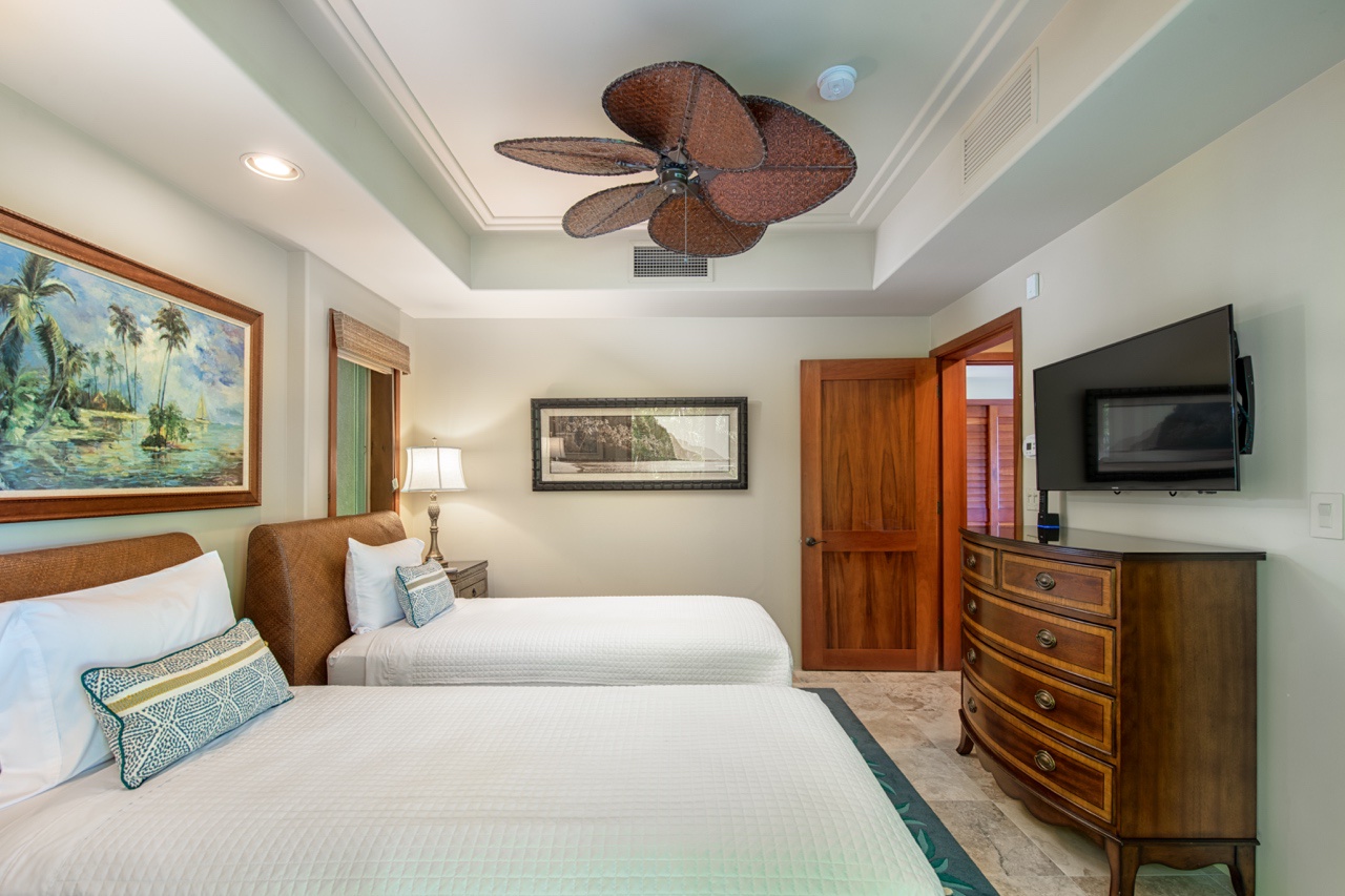 Kailua Kona Vacation Rentals, 2BD Hillside Villa (4102) at Hualalai Resort - The bedroom has TV, ceiling fan, central AC and easy access to the second bathroom.