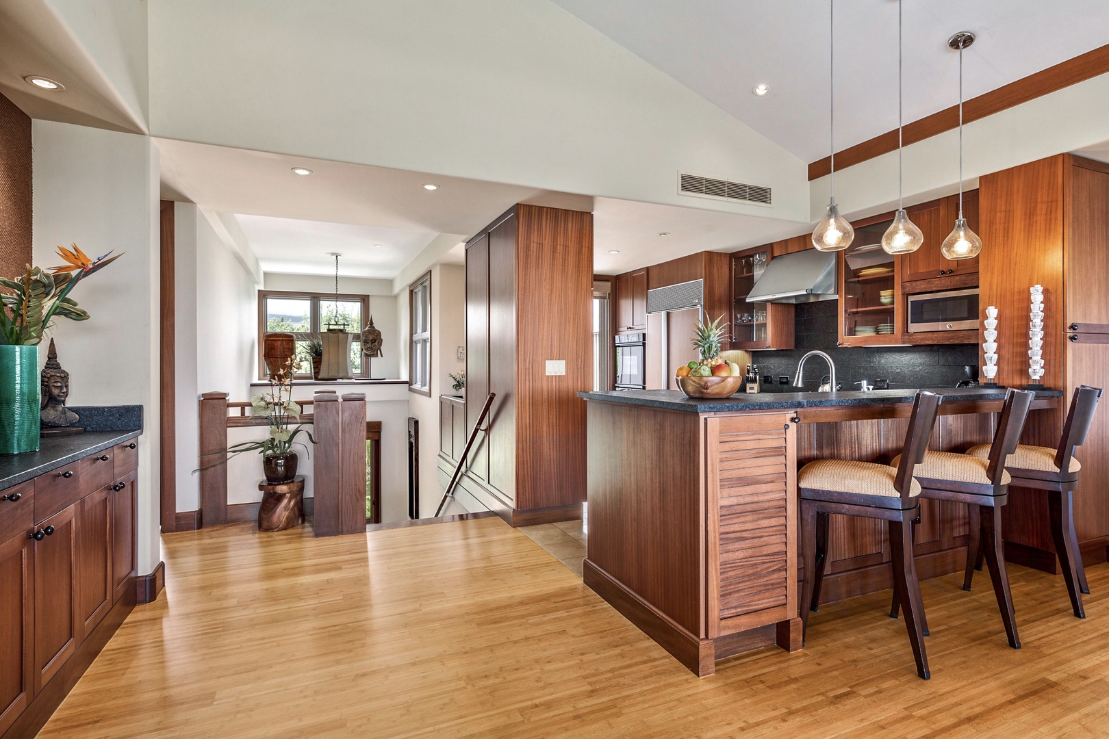 Kailua Kona Vacation Rentals, 3BD Ka'Ulu Villa (131C) at Hualalai Resort - Wider view of upper level with bar seating into the open floor plan kitchen.