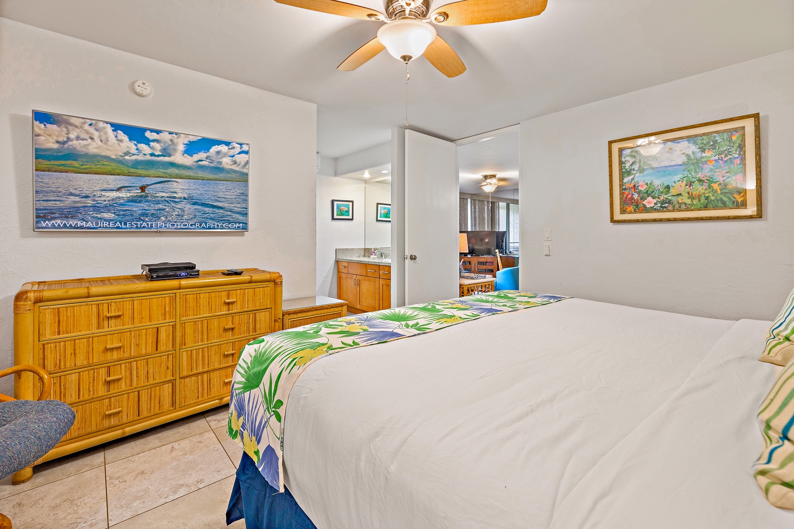 Lahaina Vacation Rentals, Papakea K-105 - The bright and airy bedroom connects to the ensuite bathroom, offering plenty of storage space and a cozy atmosphere for restful nights.