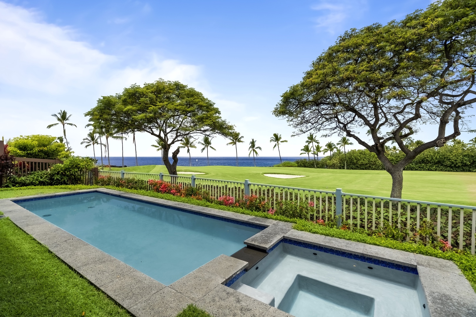 Kailua Kona Vacation Rentals, Holua Kai #27 - First swim of the trip, the fairway greens spread out just past the fence.