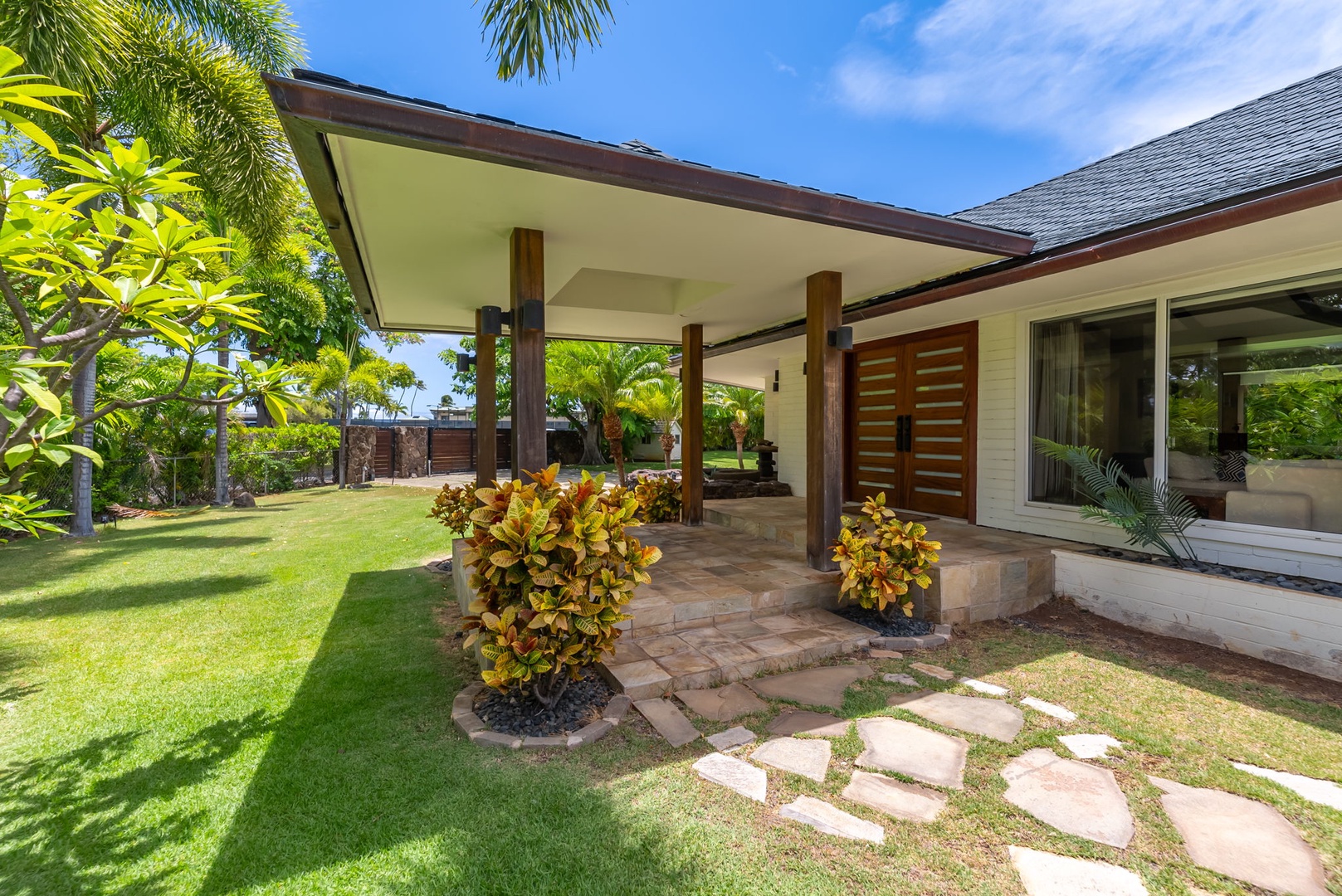 Honolulu Vacation Rentals, Kahala Lani - Inviting covered entryway with stone path, a warm welcome to your island retreat.