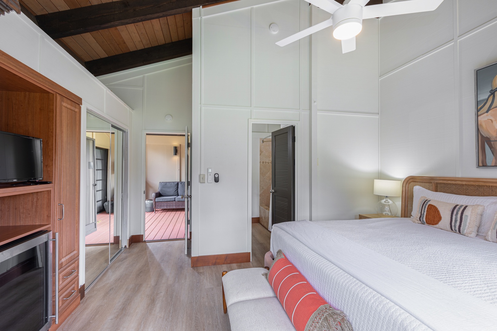 Princeville Vacation Rentals, Mauna Kai 11 - The lockout bedroom features a plush king bed, calming tropical tones, and full A/C comfort—making it a peaceful retreat within the home.