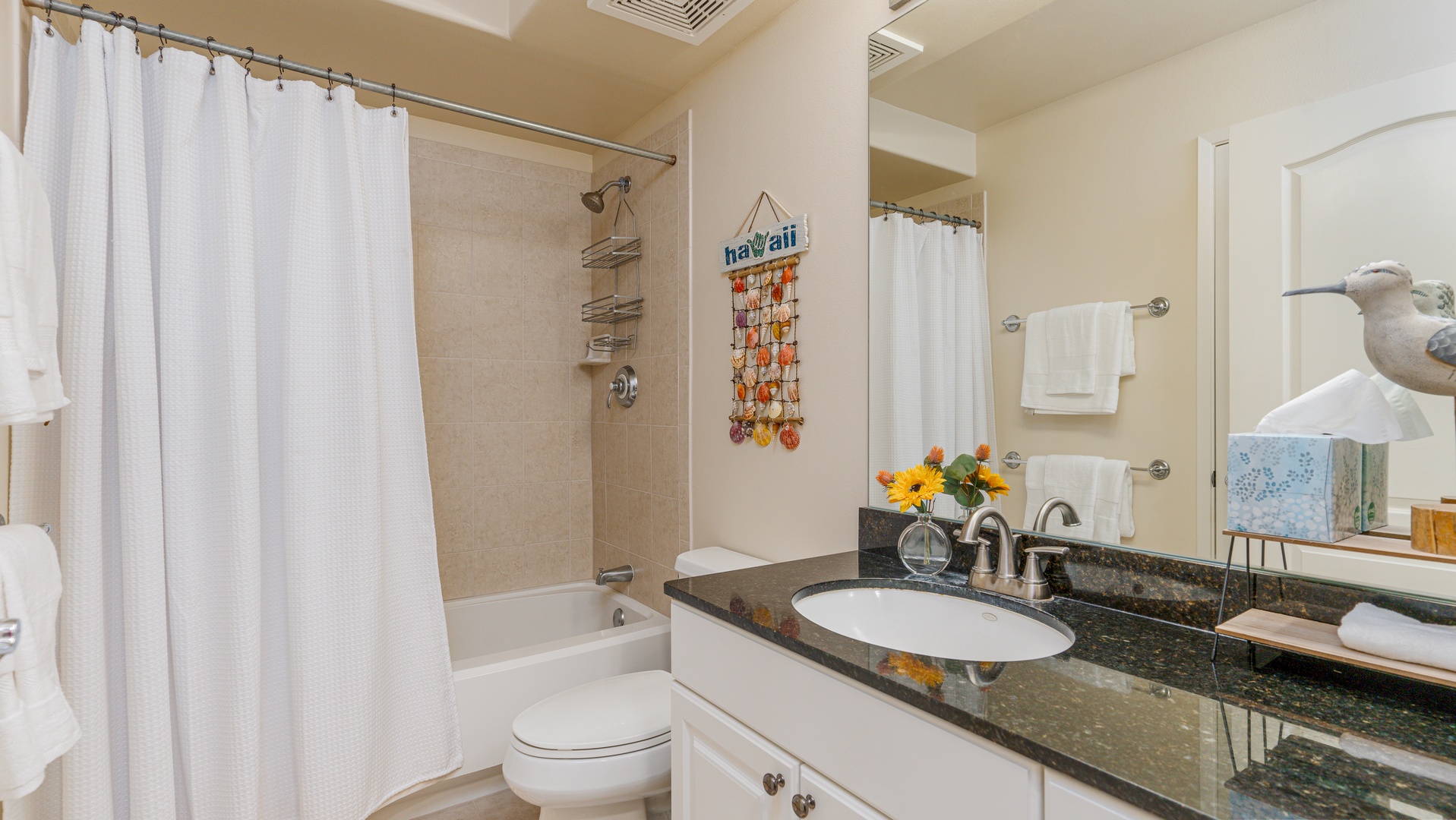 Kapolei Vacation Rentals, Ko Olina Kai 1027A - The second guest bathroom with a shower and tub combo.