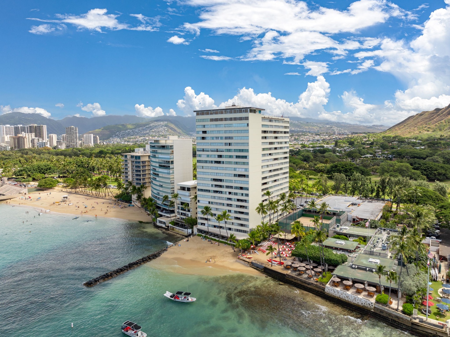 Honolulu Vacation Rentals, Colony Surf Luxe - This aerial showcases the property’s proximity to calm ocean waters—ideal for snorkeling, paddling, or just floating the day away.