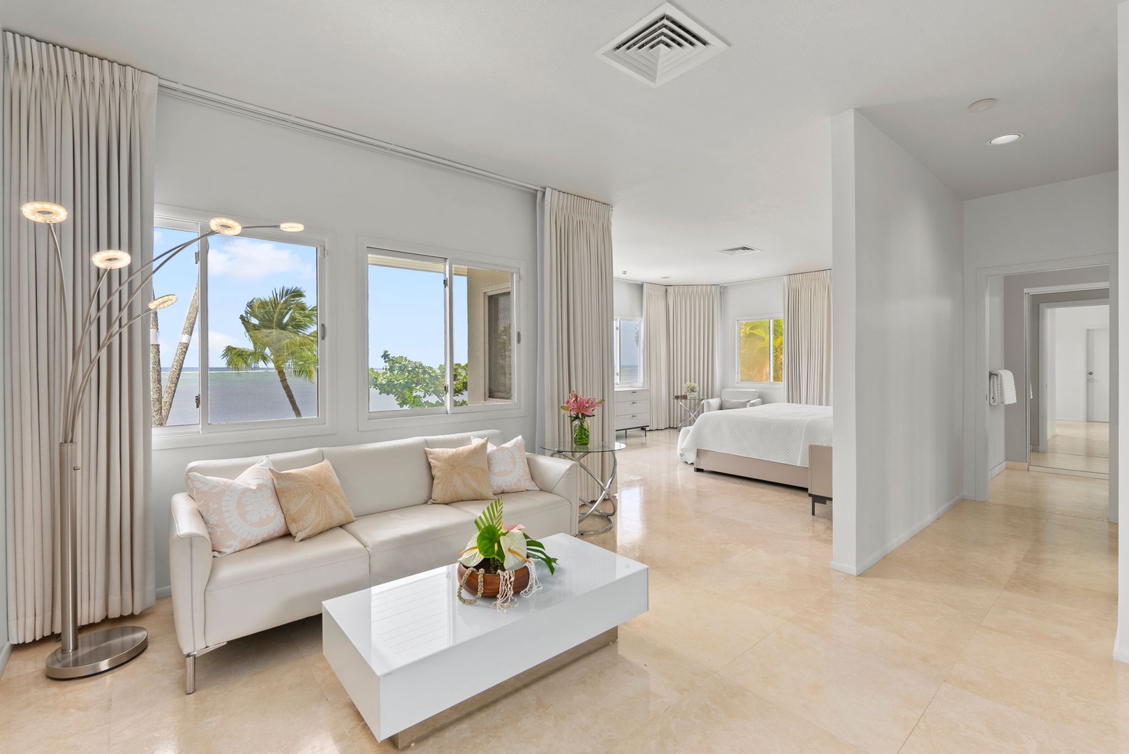 Honolulu Vacation Rentals, Paradise Beach Estate - Enjoy the comfort of a spacious suite featuring a king bed, private sitting area, and serene views of the tropical grounds.
