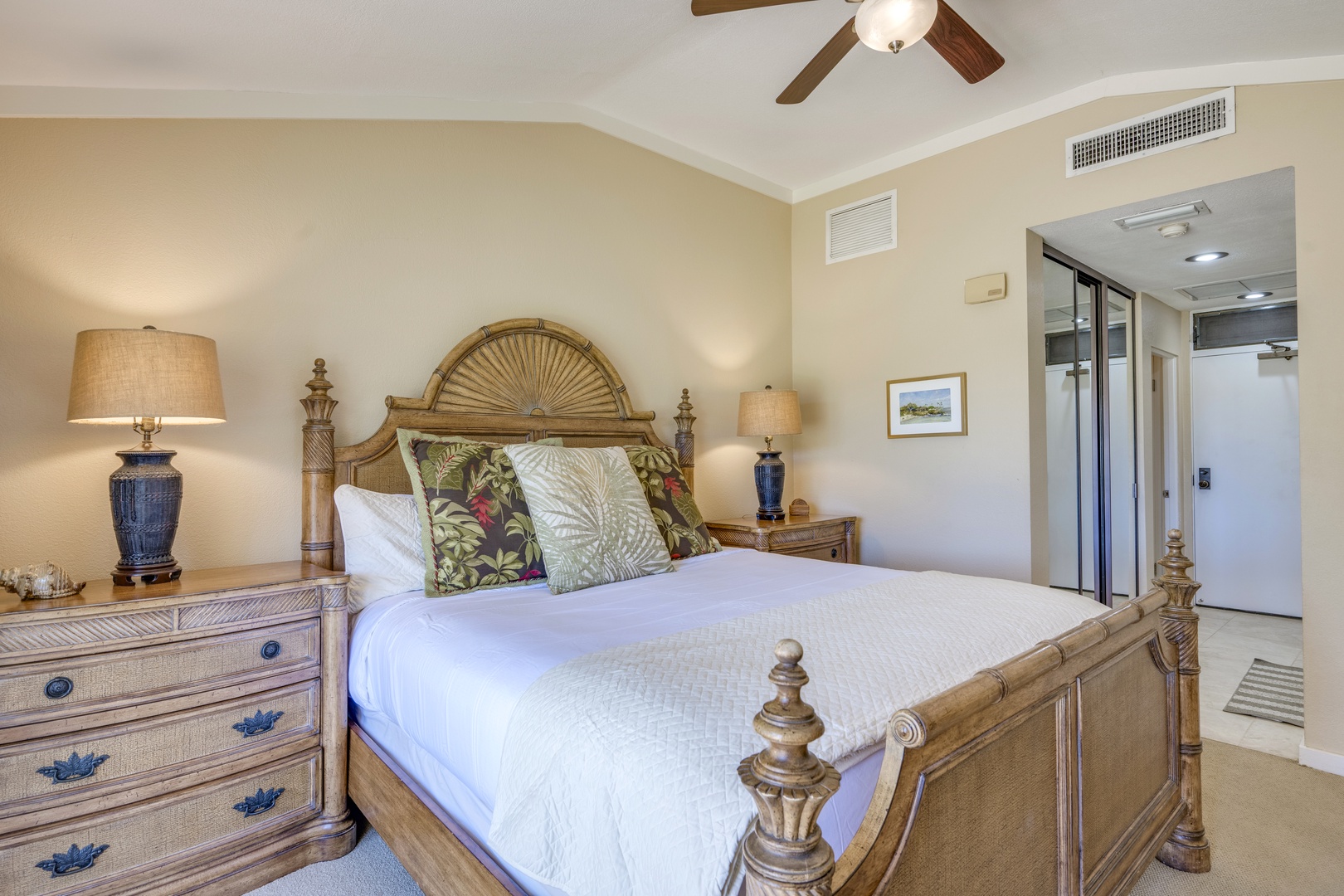 Lahaina Vacation Rentals, Kapalua Golf Villas 14P1-2 - Another view of the serene guest bedroom highlights the warm wood furniture and spacious layout.