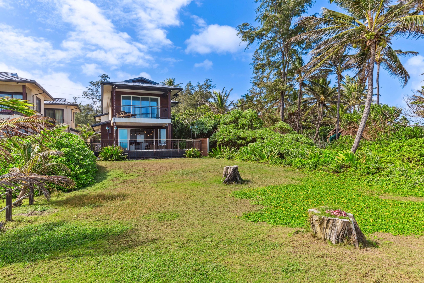 Laie Vacation Rentals, Majestic Mahakea Oceanfront Oasis - Expansive green lawn area, ideal for outdoor activities or relaxing under the tropical sun.