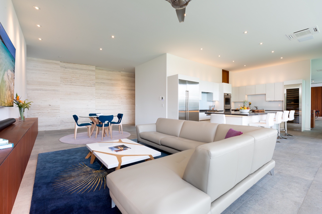 Kamuela Vacation Rentals, Puako’s Ocean Edge Modern Estate - Luxuriously spacious media room flows into a modern kitchen, perfect for social gatherings.