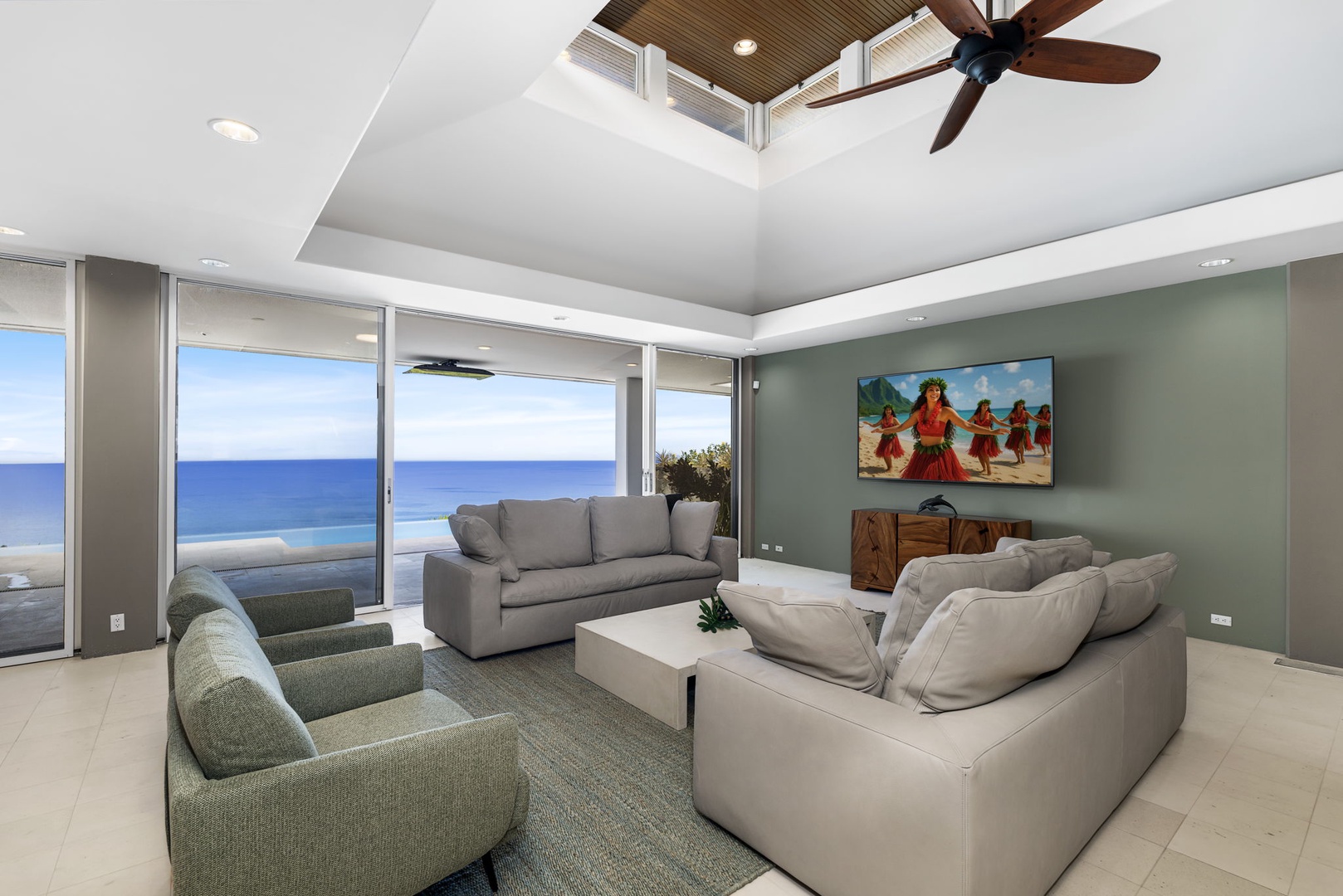 Kailua Kona Vacation Rentals, Hale Nai'a - Sink into plush seating while gazing at endless ocean views through floor-to-ceiling windows in your bright, airy living space.