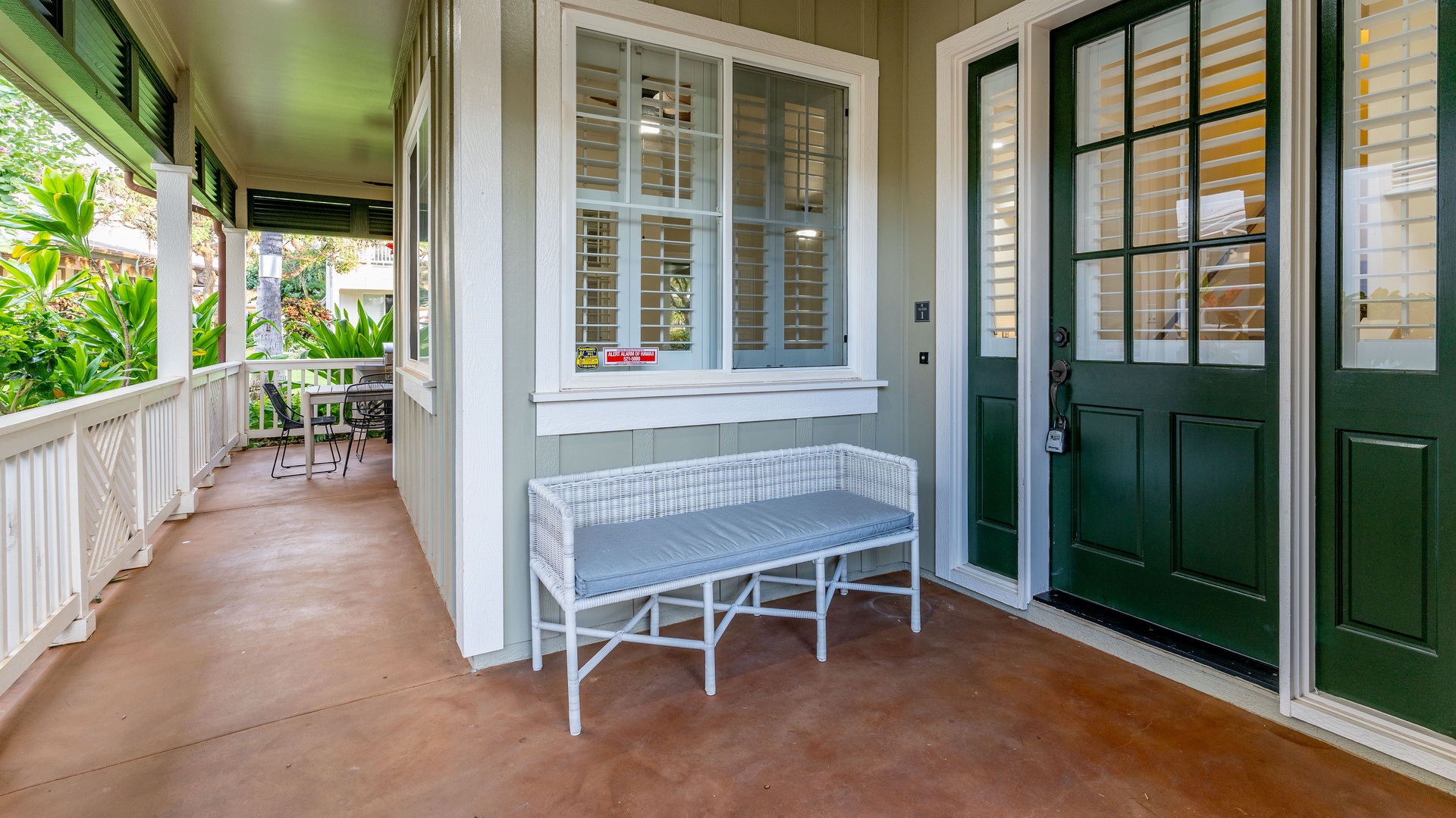 Kapolei Vacation Rentals, Coconut Plantation 1158-1 - Cozy bench seating and cheerful colors at the entrance of the condo.