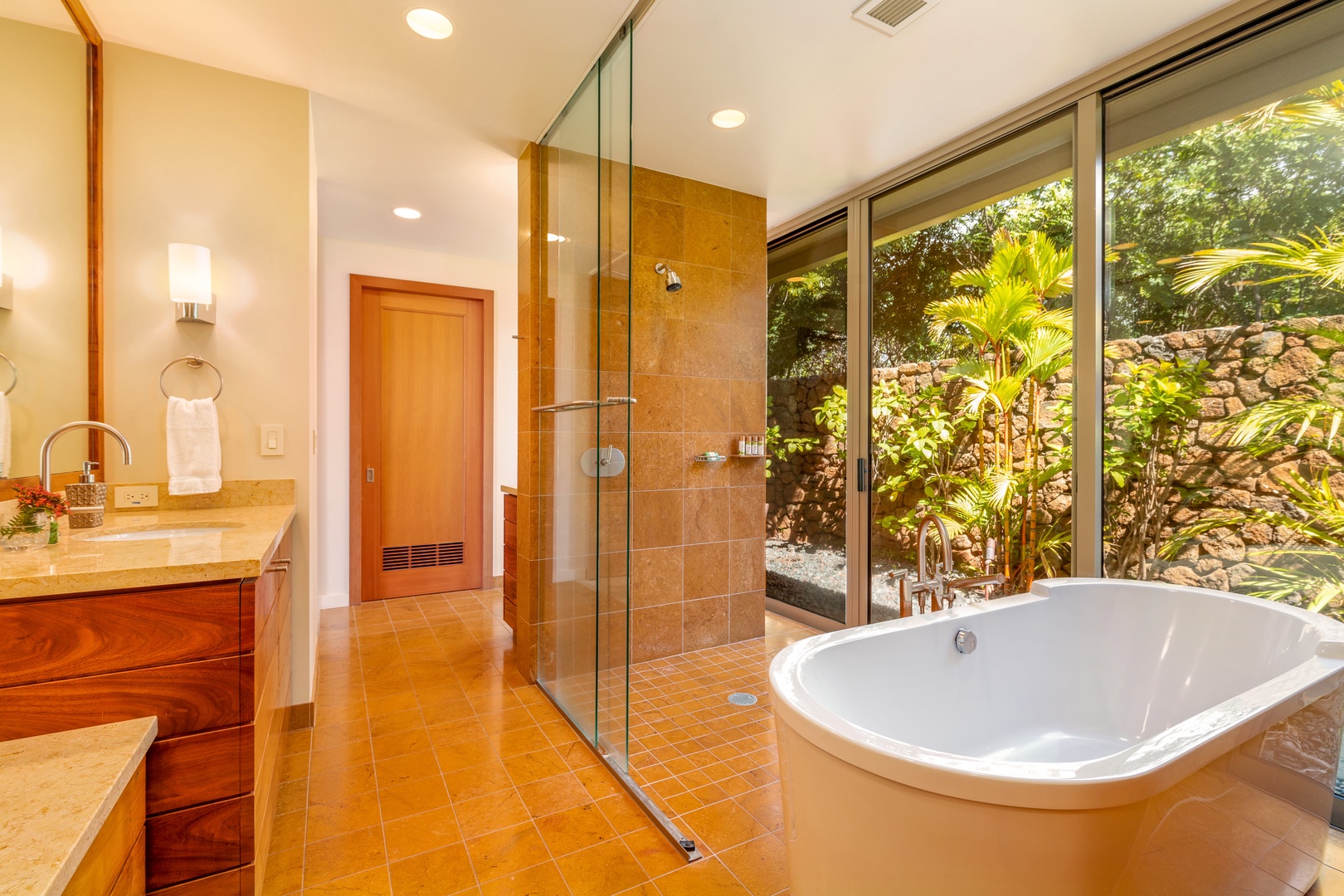 Kamuela Vacation Rentals, Mauna Kea Resort Bluffs 22 - The Beach House - A glass-walled shower and tropical garden views turn this ensuite into a spa-like escape.