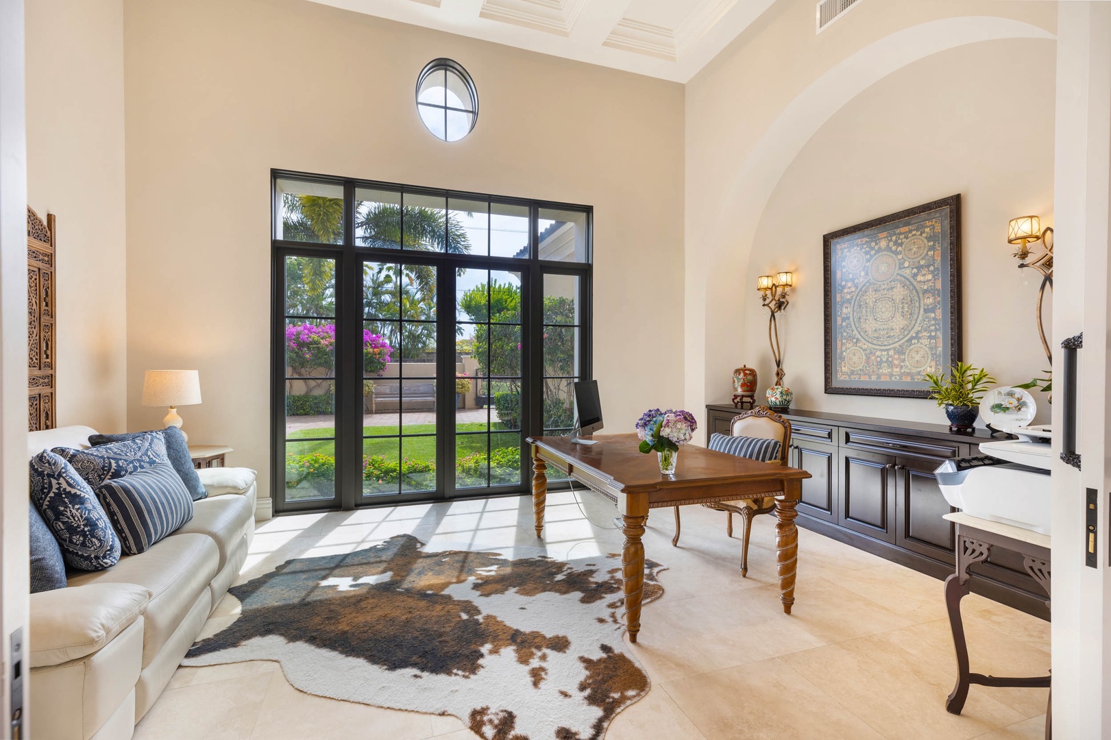 Honolulu Vacation Rentals, The Kahala Mansion - Elegant interior space featuring tall black-framed French windows.