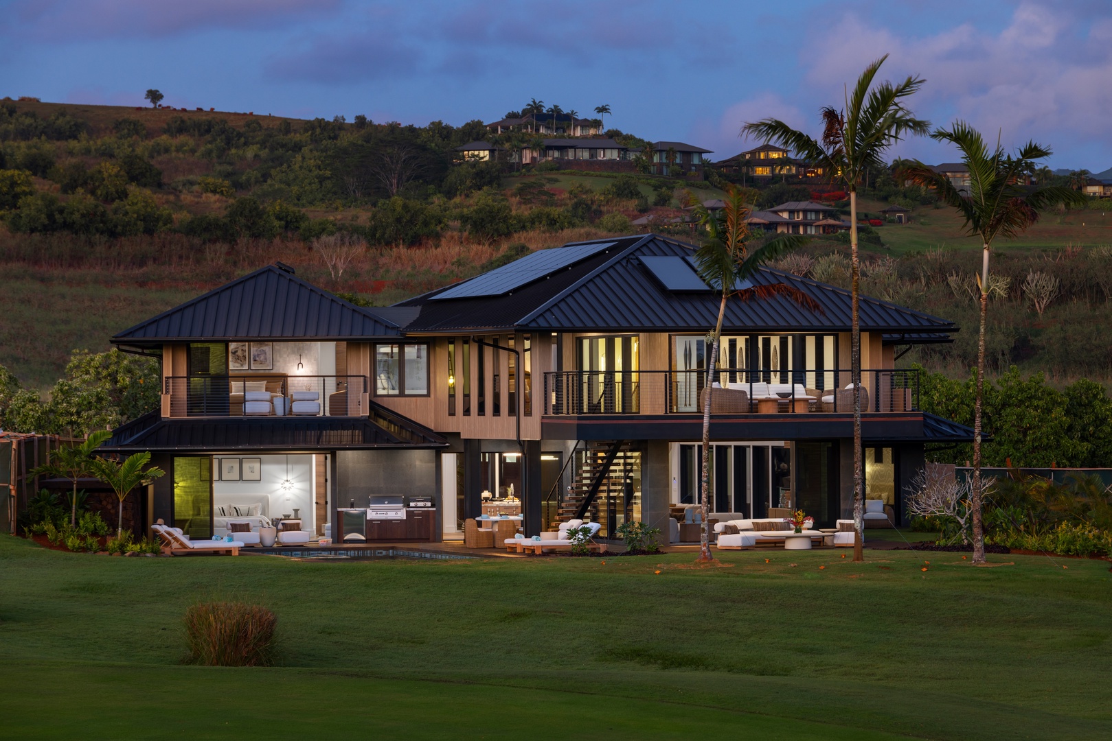 Koloa Vacation Rentals, Hale o ka Nene - Experience the magic of Hale o ka Nene illuminated at dusk, perfect for luxurious gatherings after dark.