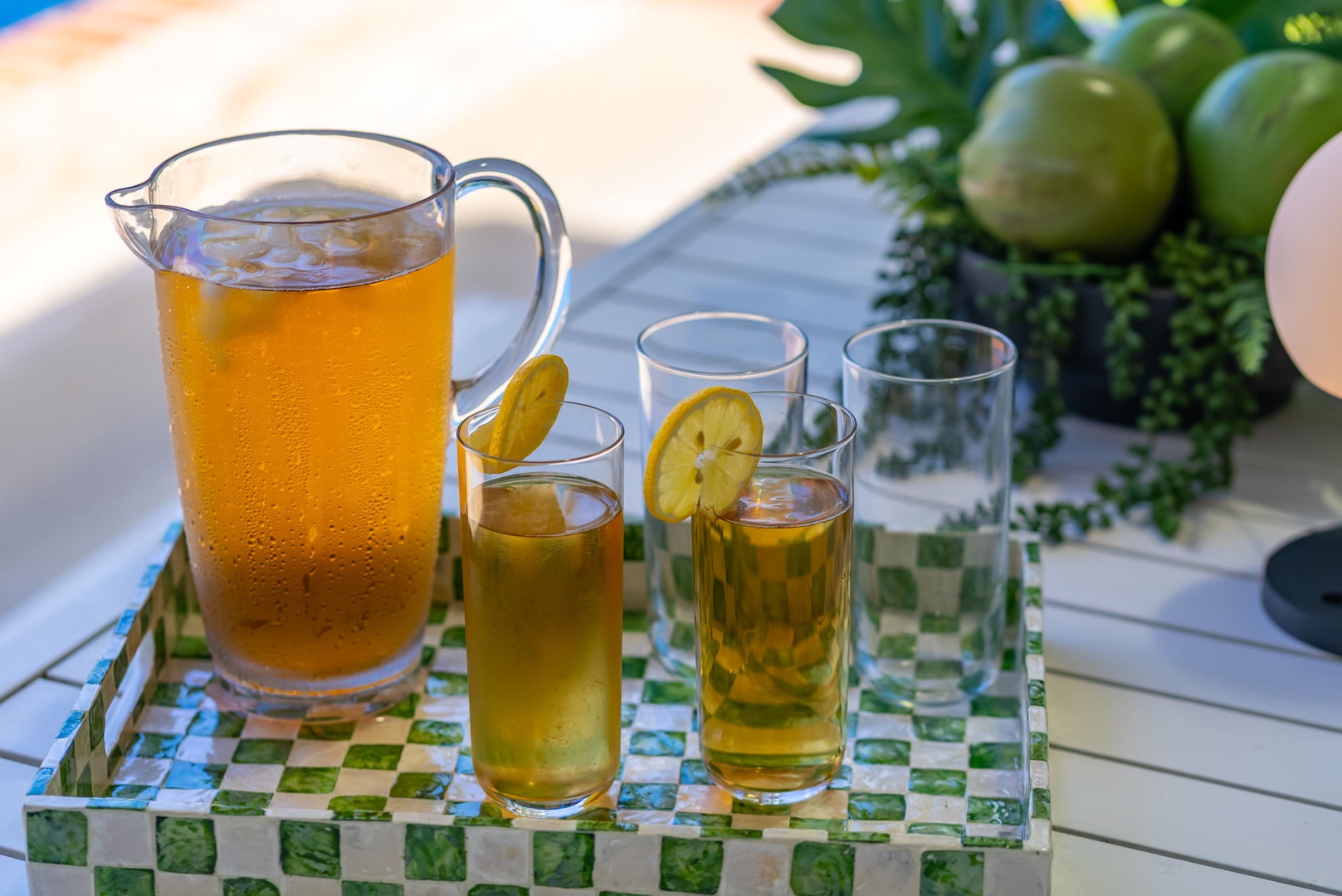 Honolulu Vacation Rentals, Ho'okipa Villa - Sip chilled citrus drinks on your private terrace, surrounded by lush greenery and warm sunlight—a refreshing moment awaits you under the open sky.
