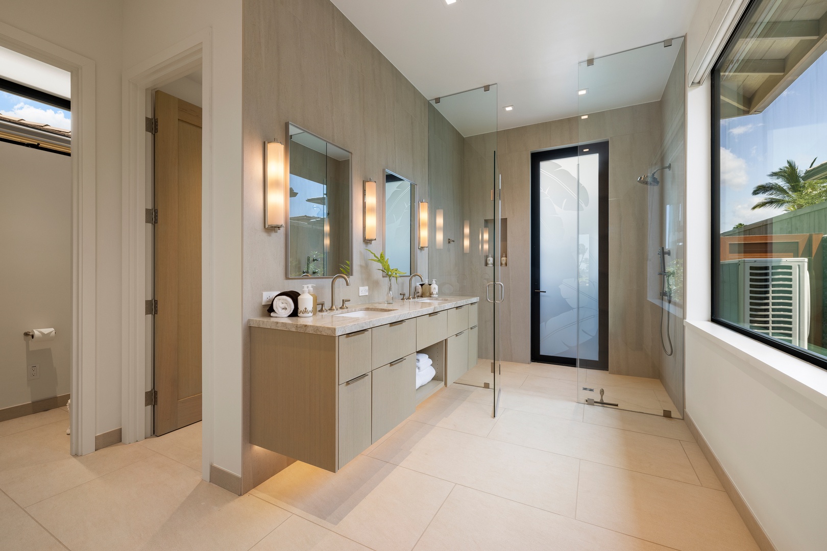 Kamuela Vacation Rentals, 6BD Mauna Lani Lux Golf Estate (5) at One Ocean - A serene guest bath offers dual vanities, a walk-in shower, and an inviting outdoor shower.