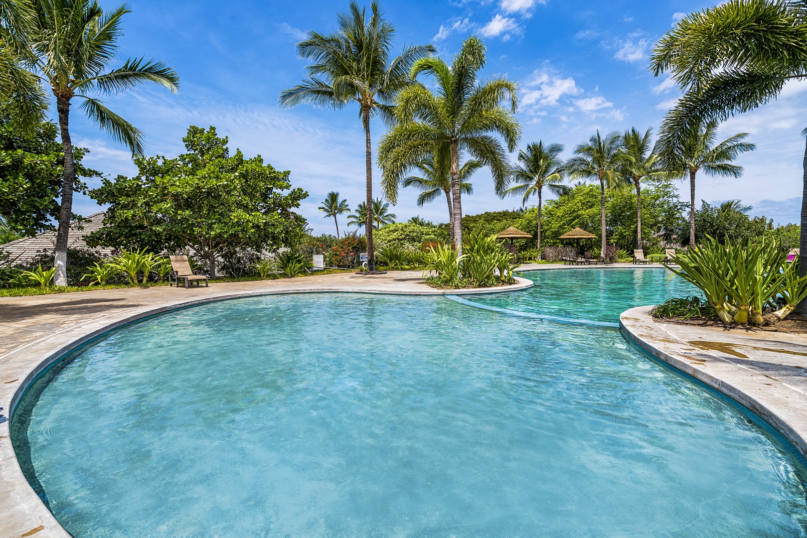 Kamuela Vacation Rentals, Mauna Lani KaMilo #503 - This tropical lagoon-style pool invites guests of all ages to splash and relax under sunny island skies.