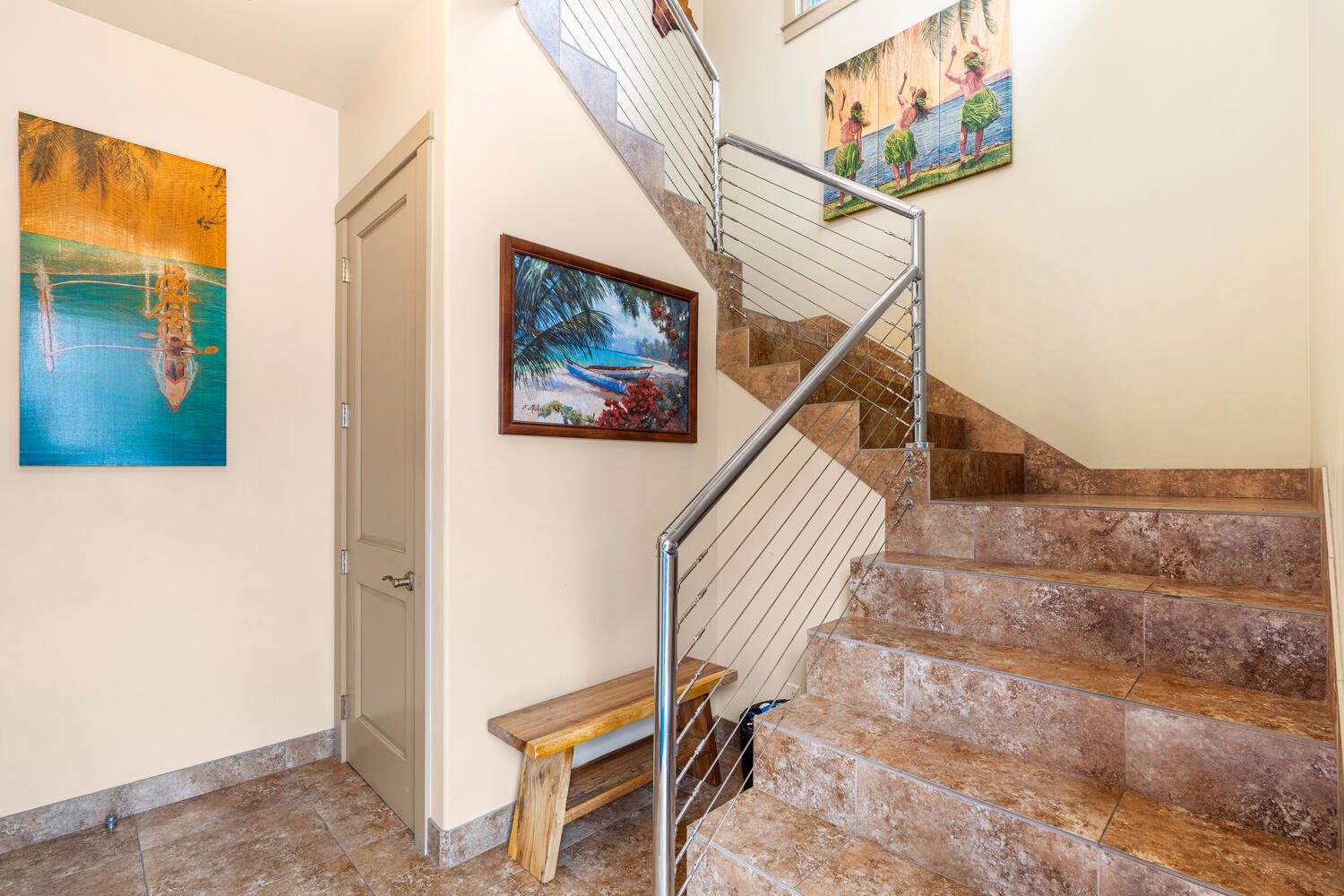 Kailua Kona Vacation Rentals, Kailani Vista - Local artwork lines the stairwell connecting all three levels, but an elevator stands by for beach-tired legs and effortless luggage transfers.