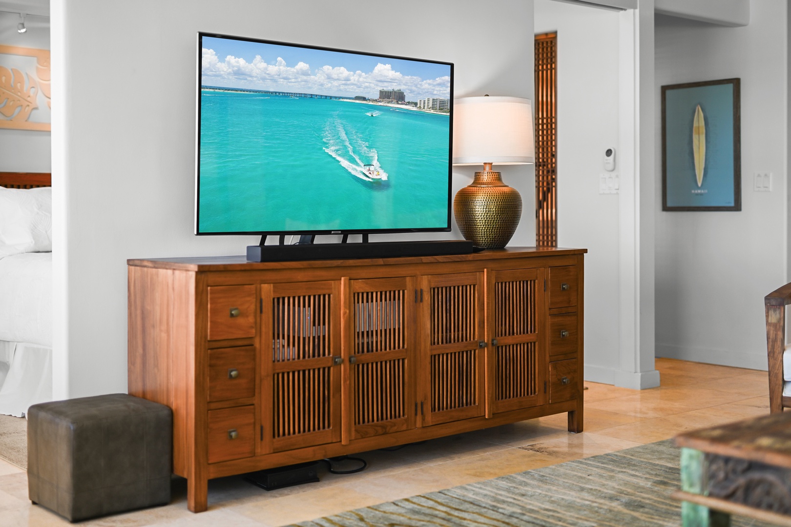 Honolulu Vacation Rentals, Kaimana Shores Getaway - Island-inspired artwork, warm furnishings and a large smart TV create a comfortable place to relax between beach adventures.