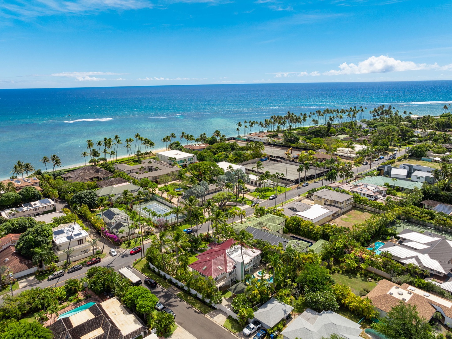 Honolulu Vacation Rentals, Kahala Oasis - Aerial view of the coastal neighborhood, capturing the villa’s proximity to the ocean and scenic surroundings.